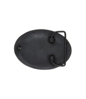 The Bed Stu Brit Oval Buckle is shown from the back, highlighting its oval shape, antiqued bronze metal finish, and secure loop-and-hook fastening mechanism.