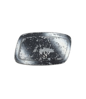 The Bed Stu Elevate Buckle is a rectangular black metal tray with worn, chipped paint and visible aging, evoking the rugged charm of a distressed belt buckle.