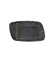 The Elevate Buckle by Bed Stu is a rectangular distressed belt buckle with a worn black finish, brass bar, and small stamped text at the top.