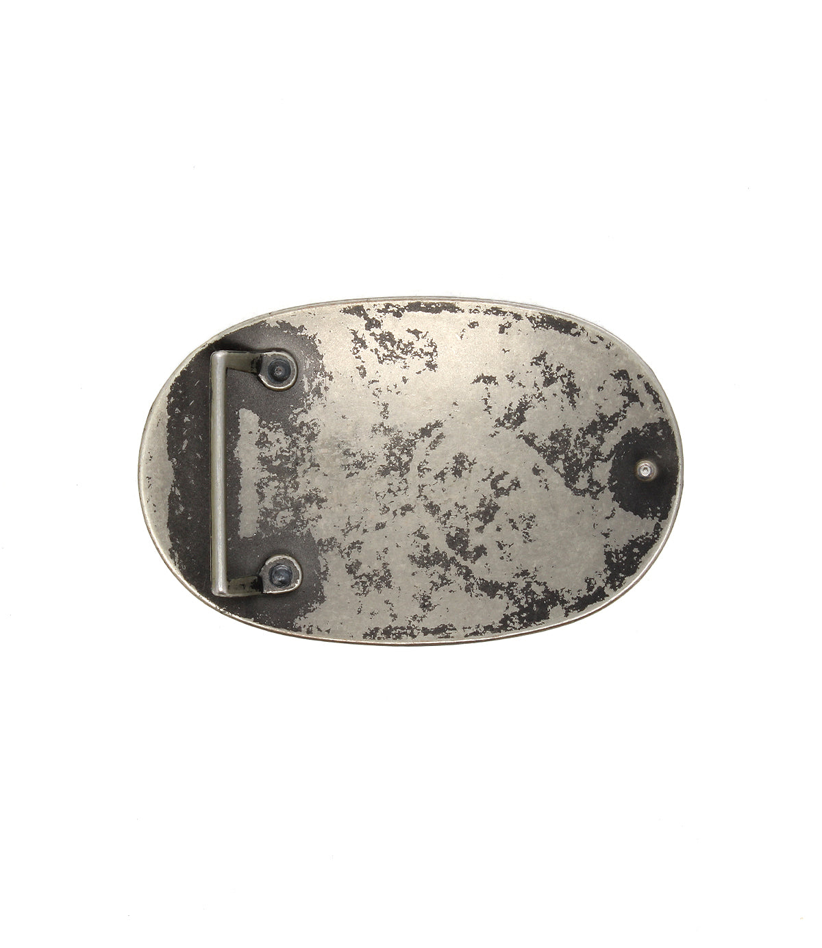 The Bed Stu Revolt Buckle is an oval, silver-tone belt buckle with a worn, tarnished finish and visible back hardware—an ideal accessory for adding a rebellious edge to any outfit.