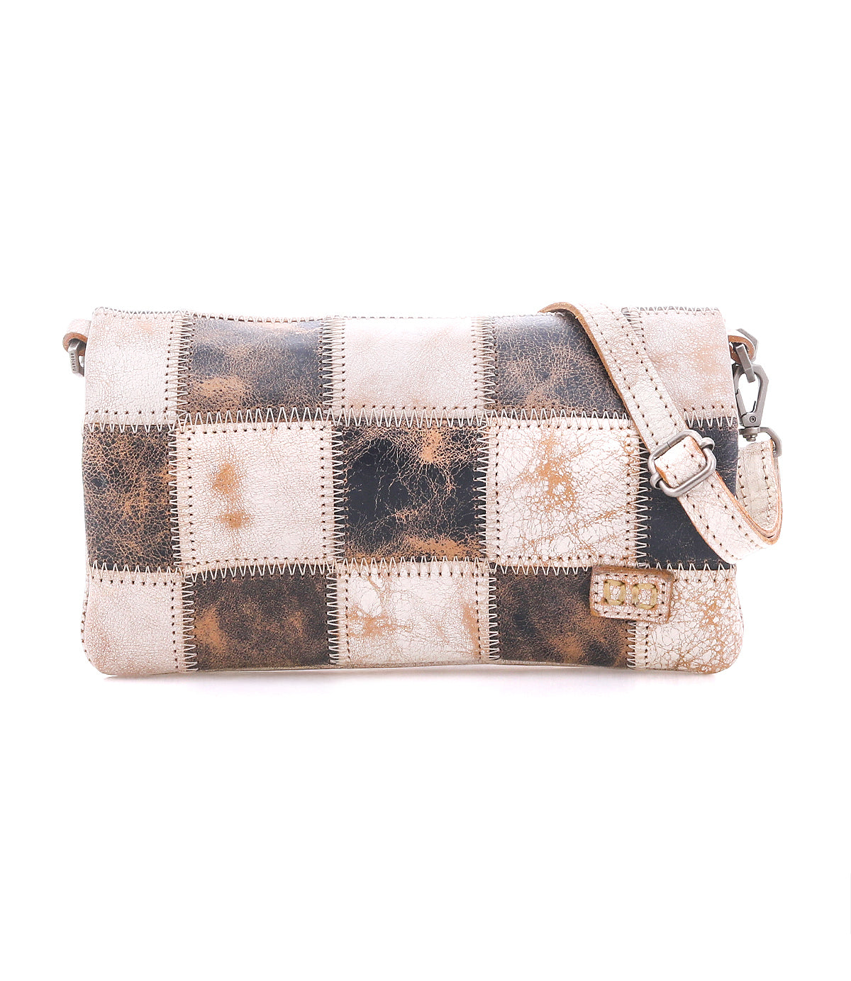 Cadence PW by Bed|Stü is a rectangular shoulder bag crafted from vegetable-tanned leather squares in brown, cream, and tan patchwork. It features a matching adjustable strap and a small tag detail on the lower right.