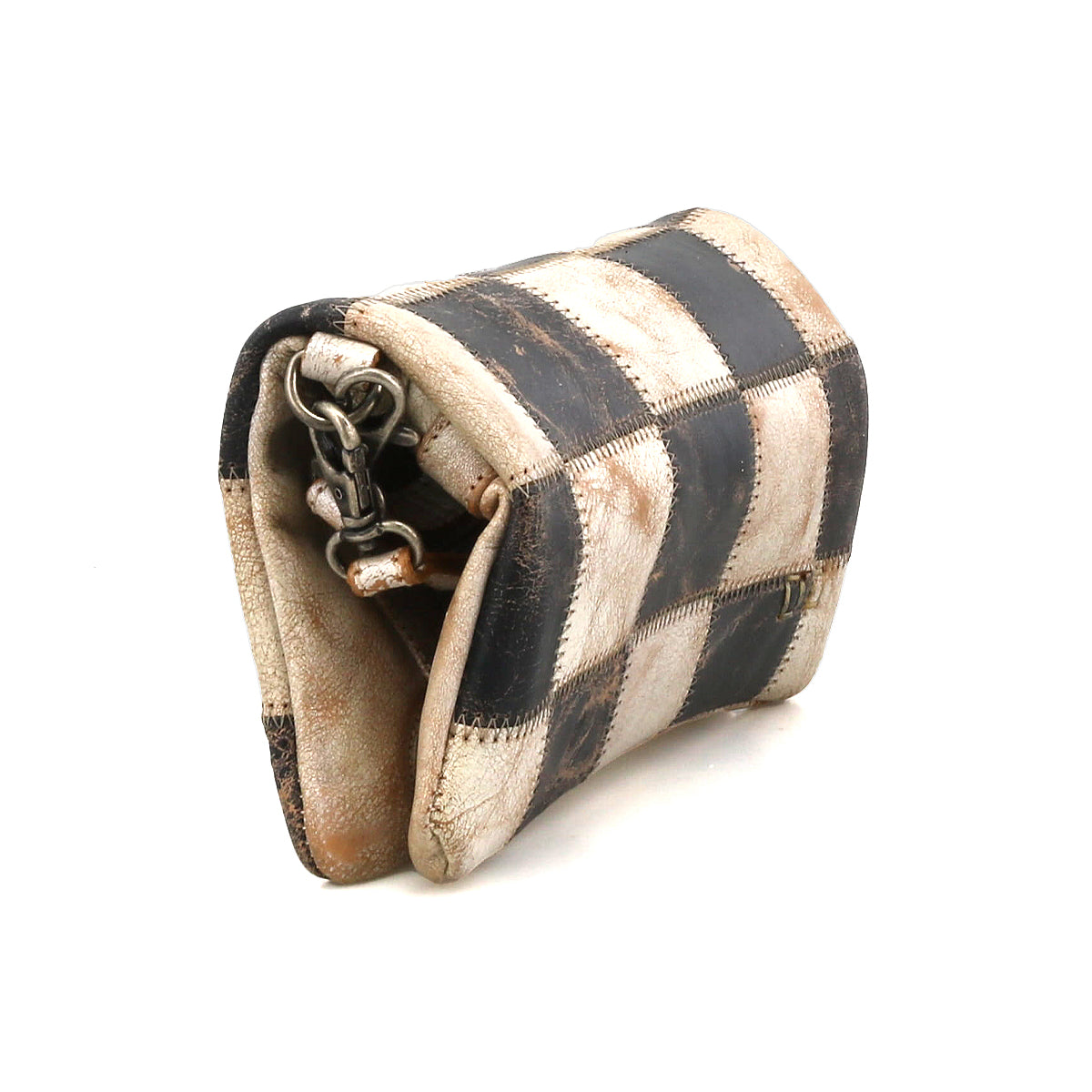 A small, worn leather Bed Stu Cadence PW crossbody bag featuring a black and white checkered pattern and a partially visible metal clasp.