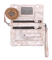 Bed|Stü Cadence PW crossbody clutch in beige vegetable-tanned leather, featuring two zippered pockets, card slots, a clear ID window, and detachable straps, laid flat on a white background.