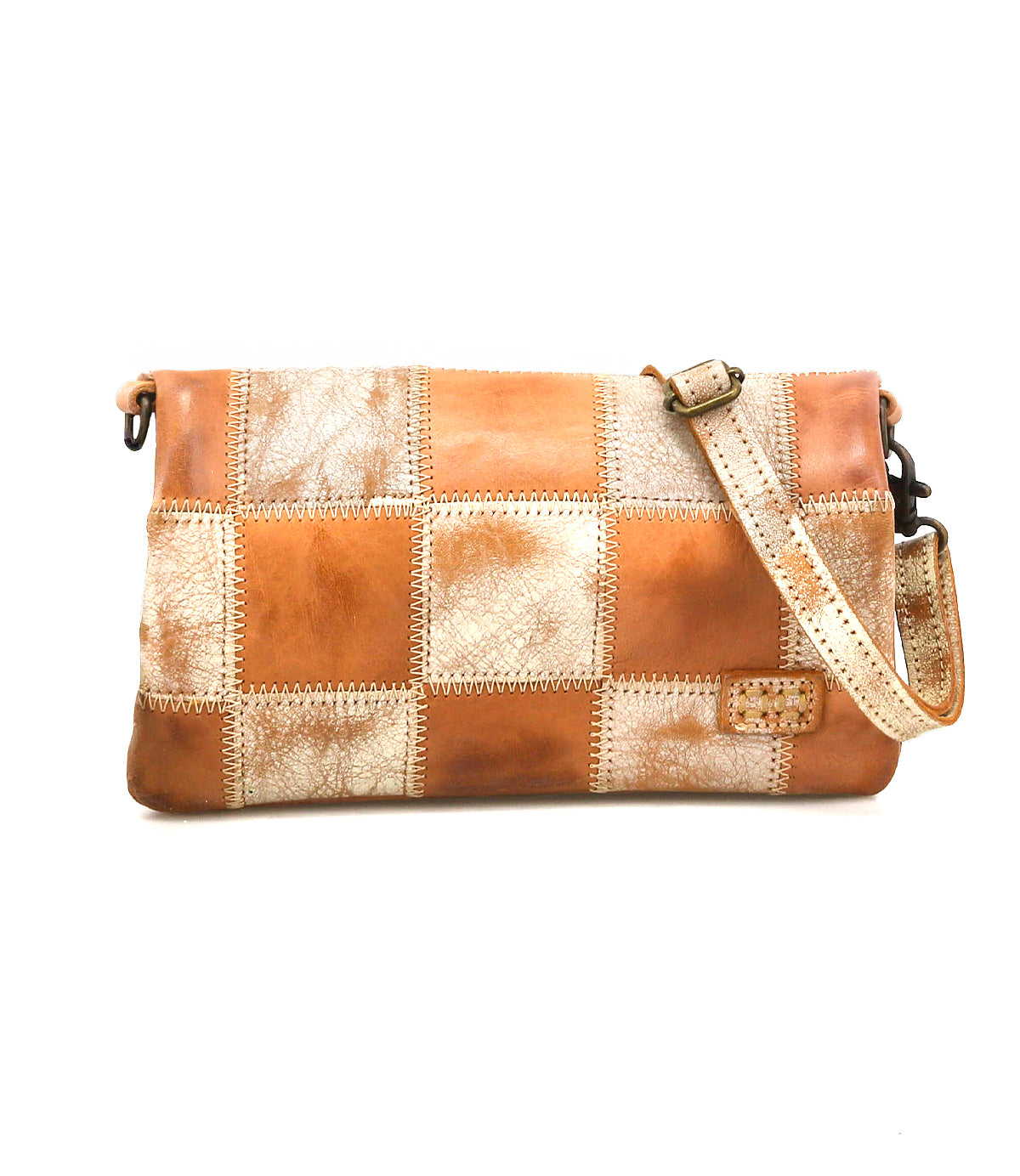 The Bed Stu Cadence PW is a rectangular patchwork leather crossbody bag with an adjustable strap, featuring tan and distressed beige squares on a white background.