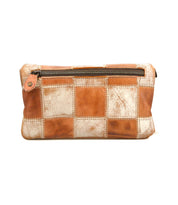 The Bed Stu Cadence PW is a brown and beige patchwork leather pouch featuring a top zipper and visible stitching, shown against a white background.