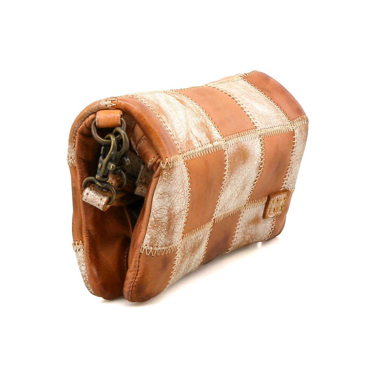 The Bed Stu Cadence PW is a small rectangular patchwork clutch crafted from tan and cream leather with visible stitching and a metal clasp at one end.