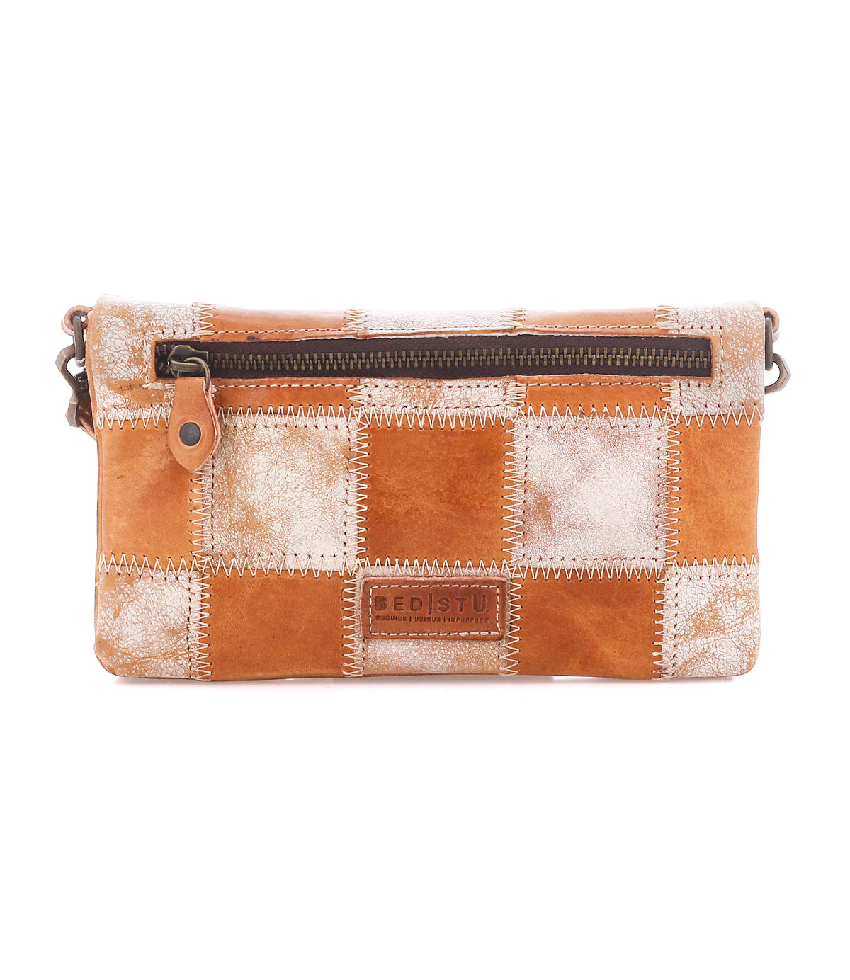 Introducing the Cadence PW by Bed|Stü—a rectangular patchwork leather crossbody clutch featuring alternating tan and white squares crafted from vegetable-tanned leather, a front zipper pocket, visible stitching, and a small embossed Bed|Stü logo on the front.