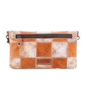 Introducing the Cadence PW by Bed|Stü—a rectangular patchwork leather crossbody clutch featuring alternating tan and white squares crafted from vegetable-tanned leather, a front zipper pocket, visible stitching, and a small embossed Bed|Stü logo on the front.