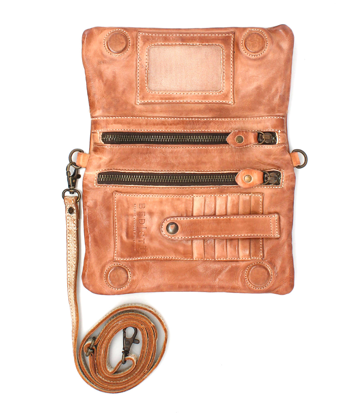 The Bed Stu Cadence PW is a brown leather crossbody travel wallet featuring two zippered compartments, card slots, an ID window, snap closures, and a detachable shoulder strap.