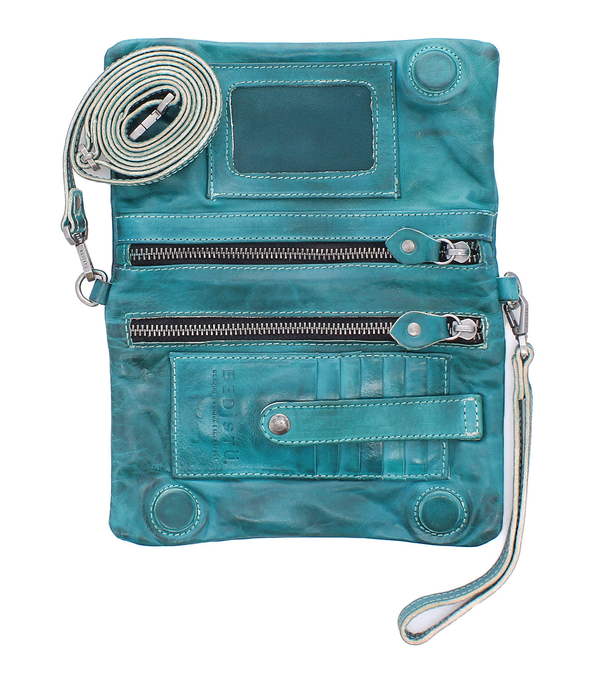 The Bed Stu Cadence is a teal crossbody clutch in vegetable-tanned leather with two front zippered pockets, transparent ID window, card slots, and detachable straps, shown laid flat and open.