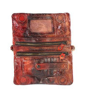 Crafted from worn vegetable-tanned leather, the Bed|Stü Cadence wallet opens to reveal two zippered pockets, multiple card slots, a clear ID window, and secure button closures.