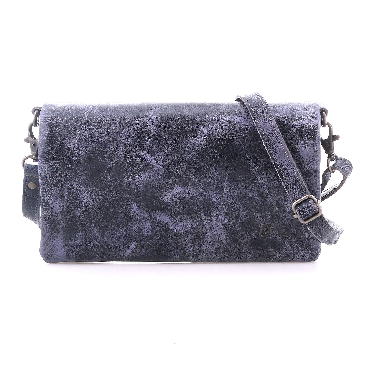 The Bed Stu Cadence is a rectangular dark blue leather crossbody bag with a textured finish and long adjustable strap, versatile enough to be worn as a clutch, shown against a white background.
