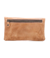 The Bed Stu Cadence is a rectangular tan full-grain leather clutch featuring a front zipper pocket and simple stitching.