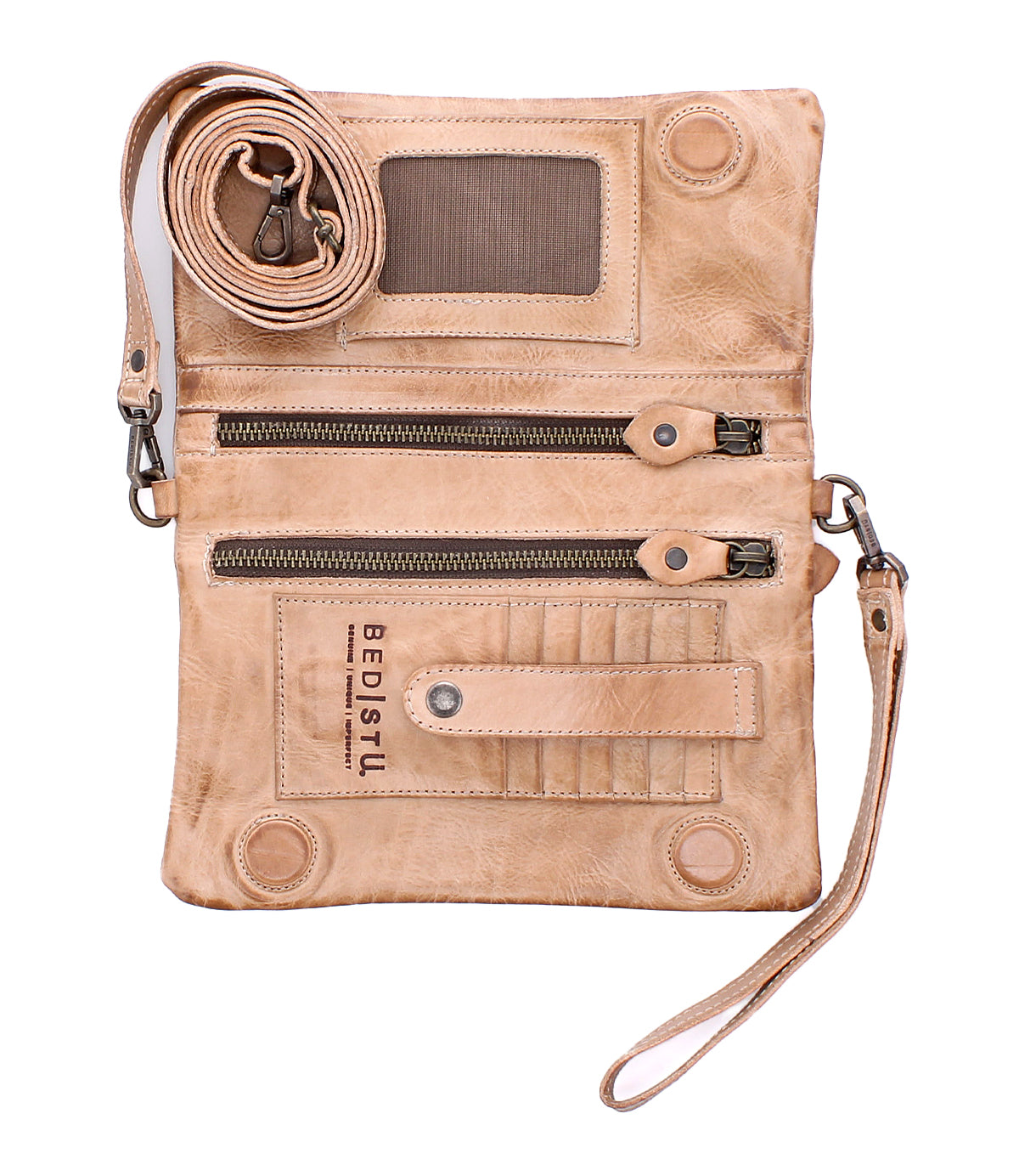 The Cadence by Bed Stu is a beige full-grain leather crossbody wallet with a detachable strap, dual zippered pockets, card slots, ID window, and embossed "BED|STU" logo on the front.