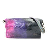 A colorful metallic Cadence crossbody clutch from Bed Stu with a gradient purple to pink pattern and a silver chain, isolated on a white background.