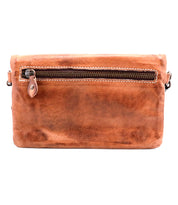 The Bed Stu Cadence is a brown leather clutch wallet featuring a visible front zipper pocket with a metal pull, shown against a white background.