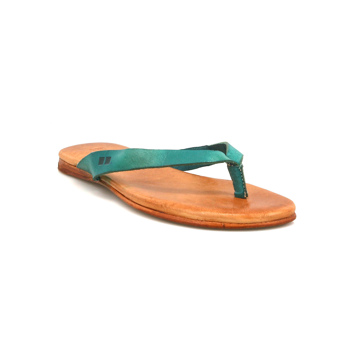 The Bed Stu Calma sandal features a brown leather sole and blue-green fabric thong strap—lightweight and comfortable, it's perfect for relaxing footwear. Shown on a white background.