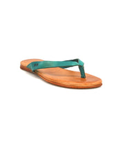 The Bed Stu Calma sandal features a brown leather sole and blue-green fabric thong strap—lightweight and comfortable, it's perfect for relaxing footwear. Shown on a white background.