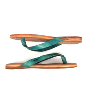 The Bed Stu Calma sandals feature lightweight, comfortable leather with tan soles and teal straps—stylish and relaxed footwear ideal for any casual day.