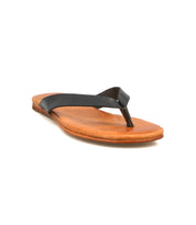 The Bed Stu Calma sandal is a brown flat leather shoe with a black thong strap, shown from a low front angle on white—ideal lightweight, comfortable footwear for relaxing days.