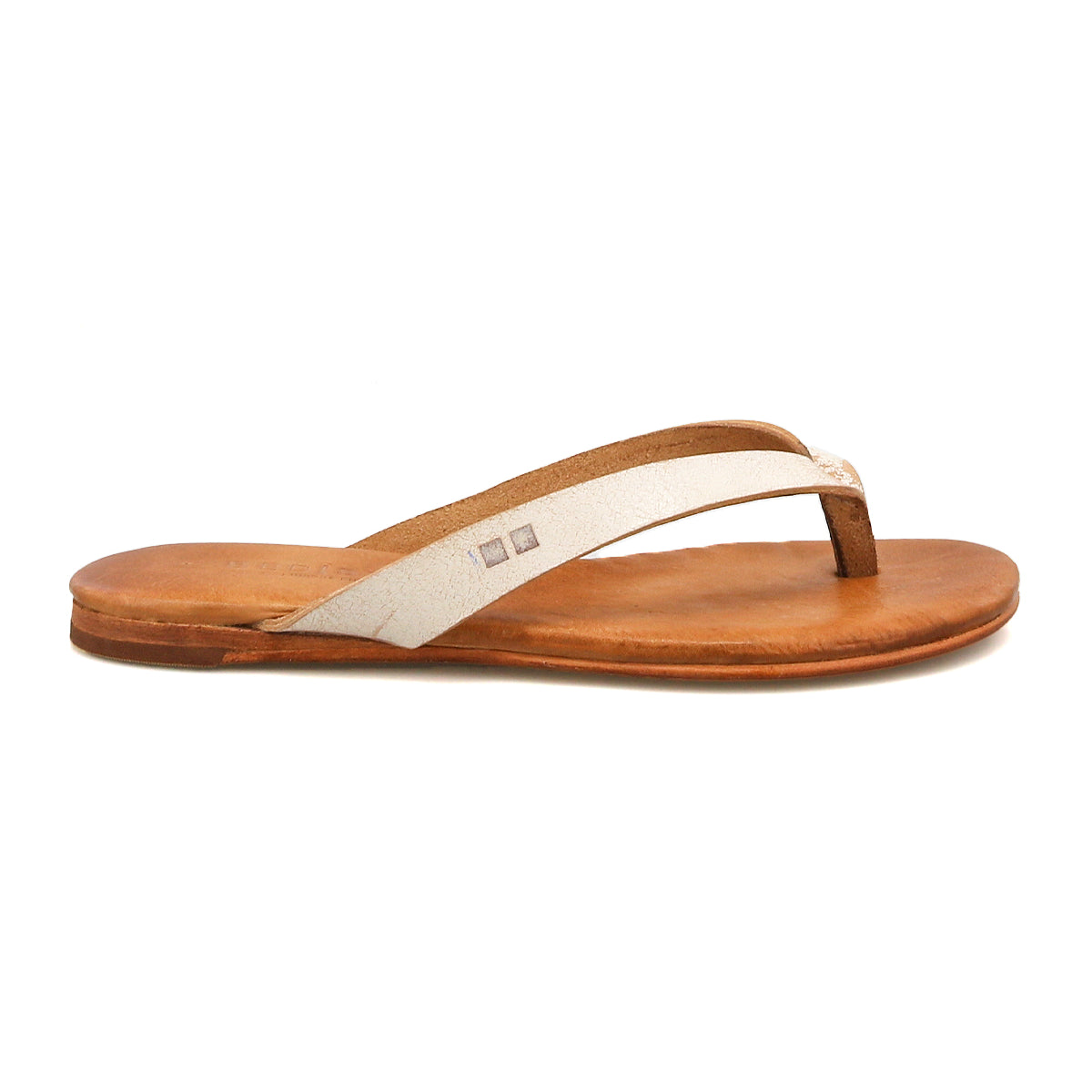 The Bed Stu Calma is a brown leather flip-flop sandal featuring a white strap and flat sole, shown from the side against a white background.