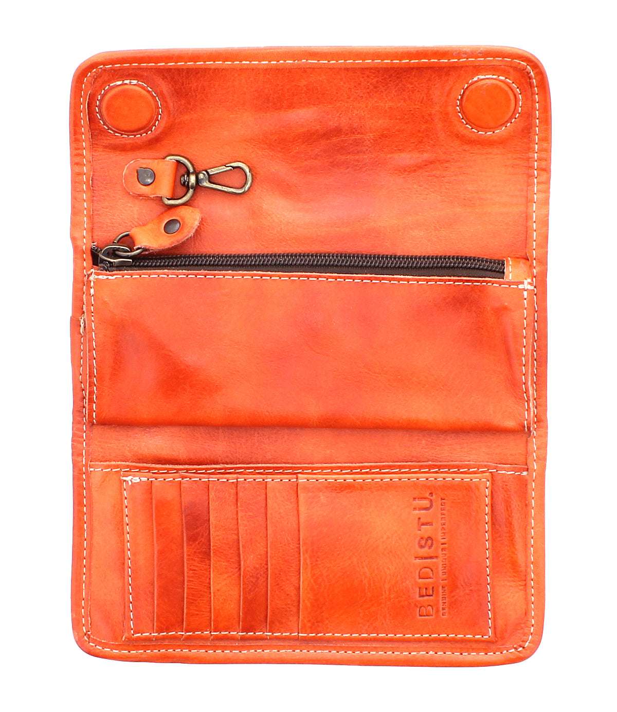 Canton by Bed Stu is an open orange leather clutch with zippered pocket, multiple card slots, snap buttons, and a metal lobster clasp. "Bed Stu" is elegantly embossed on the lower right side.