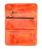 Canton by Bed Stu is an open orange leather clutch with zippered pocket, multiple card slots, snap buttons, and a metal lobster clasp. "Bed Stu" is elegantly embossed on the lower right side.
