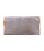 The Bed Stu Canton is a rectangular gray clutch with beige and glittery gold side trim. This stylish 2-in-1 accessory serves as both a chic clutch and a leather wallet, shown against a white background.