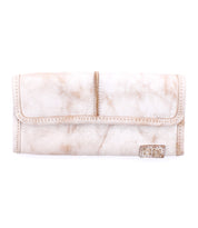 The white leather Canton wallet by Bed Stu features a textured finish, convenient card slots, and a small metal logo plaque on the bottom right corner.