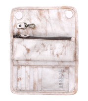 The Bed Stu Canton clutch is a stylish white leather accessory featuring an open design, card slots, a zipper pocket, and snap closure buttons.