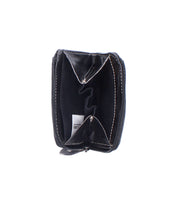 The Bed|Stü Carrie black zippered slim wallet is open to display two empty compartments with easy-access card slots, visible stitching, and a small white tag inside.