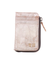 Introducing Carrie by Bed|Stü, a compact leather wallet in light beige featuring visible stitching, two easy-access card slots, a metal zipper on the right side, and two small square gold accents on the lower front.