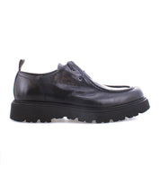 The Casotto by Bed Stu is a men's boot that displays exquisite Italian craftsmanship and a touch of retro flair, featuring black leather with lace-up detailing and a thick, rugged sole visible from the side.