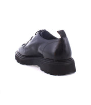 Casotto by Bed Stu, a black leather lace-up shoe featuring a chunky sole and retro flair, shown from the rear angle against a white background.