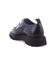 Casotto by Bed Stu, a black leather lace-up shoe featuring a chunky sole and retro flair, shown from the rear angle against a white background.