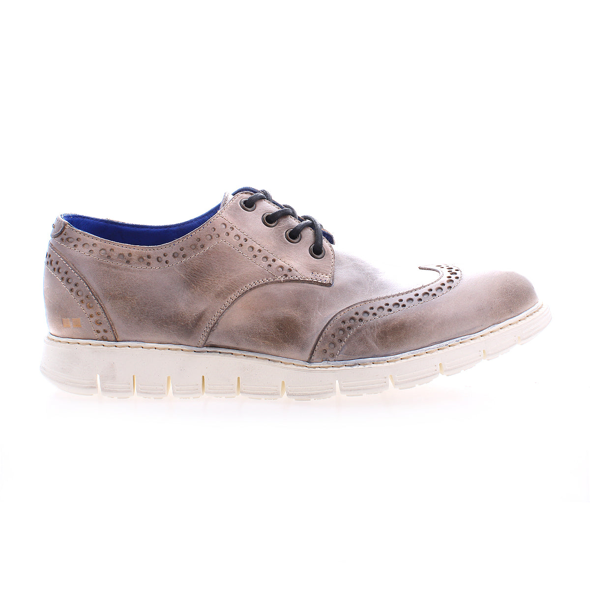 The Bed Stu Cayuga II is a brown leather wingtip shoe featuring lightweight construction, brogue details, black laces, and a white sole—ideal for the casual male seeking both style and comfort.