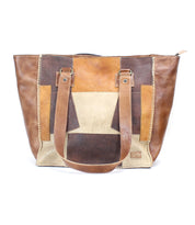 A brown and tan leather Celindra LTC II tote bag with vibrant multi-colored patches by Bed Stu.