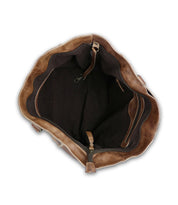 The vibrant multi-colored patches accent the inside of a Bed Stu Celindra LTC II bag.
