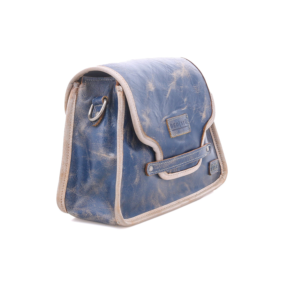 The Bed Stu Ceremonious is a blue leather preppy bag with beige trim, metal hardware, and a magnetic flap-top closure, shown against a white background.