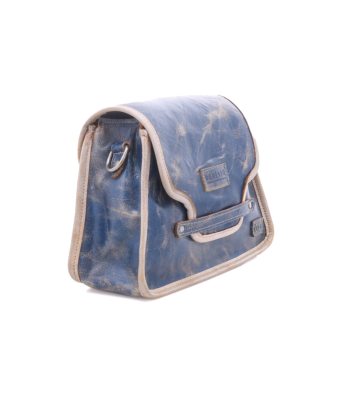 The Bed Stu Ceremonious is a blue leather preppy bag with beige trim, metal hardware, and a magnetic flap-top closure, shown against a white background.