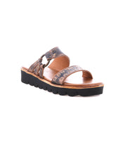 The Bed Stu Chow sandal features a distressed leather, floral design with two straps and a chunky rubber sole with wave pattern, providing comfort with its cushioned footbed.