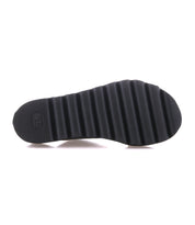 The Bed Stu Chow features a black rubber sole with chunky ridges and grooves for grip, alongside a cushioned footbed for comfort.