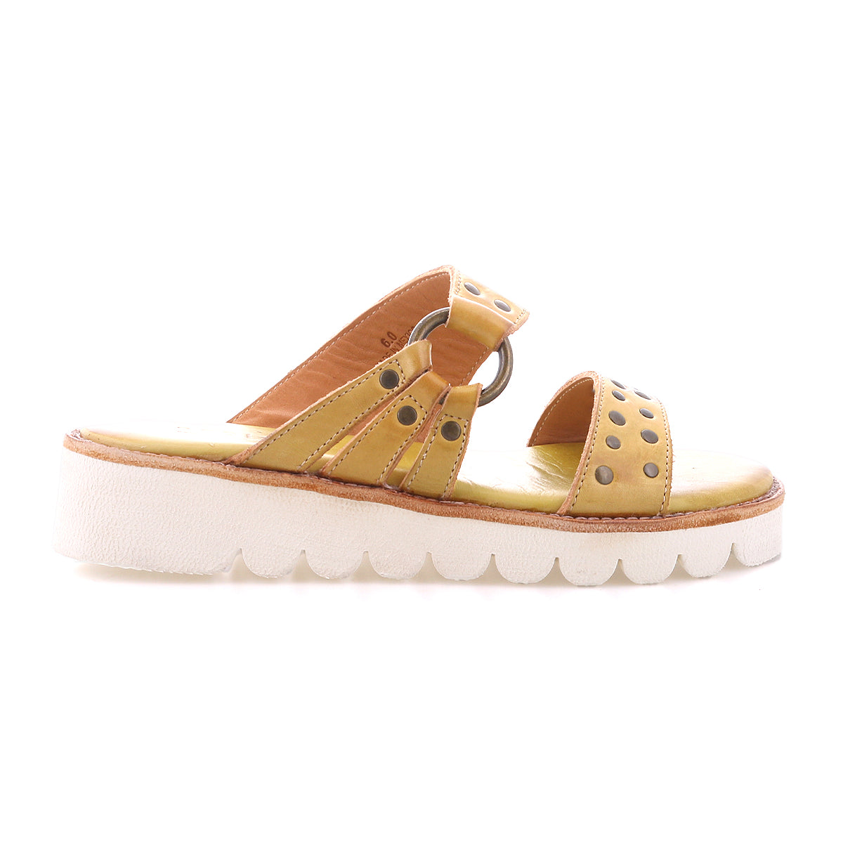 The Bed Stu Chow is a yellow slip-on sandal featuring two perforated straps, metal ring detail, and a chunky rubber sole with cushioned footbed, shown in side profile.