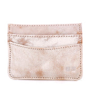 The Bed Stu Chuck is a beige, textured leather compact card wallet featuring two card slots and visible stitching, shown against a white background.