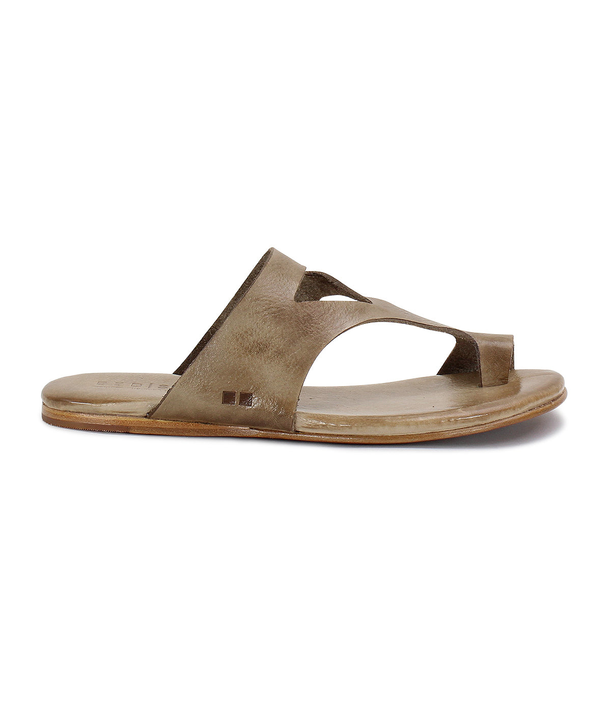 A single brown leather sandal made from vegetable-tanned leather, featuring a cut-out design, flat sole, open toe, and slip-on style, viewed from the side. The product is called Civilized by Bed Stu.
