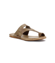 Brown leather Civilized sandal by Bed Stu with two crossed straps and a flat sole made from vegetable-tanned leather, shown from a front side angle on a white background.