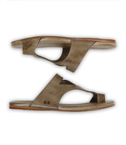 A pair of brown leather sandals, known as Civilized by Bed Stu, crafted from exceptional quality materials, featuring cut-out details, flat soles, and an open-toe design, displayed against a white background.