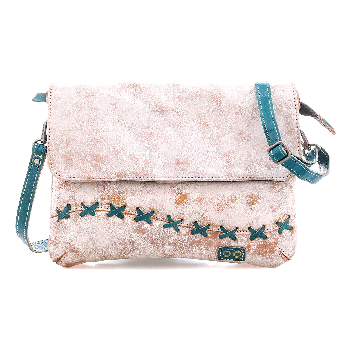 The Cleo crossbody bag by Bed Stu features light brown faux leather, a flap closure, an adjustable teal strap, and bold teal X-shaped stitching on the front.