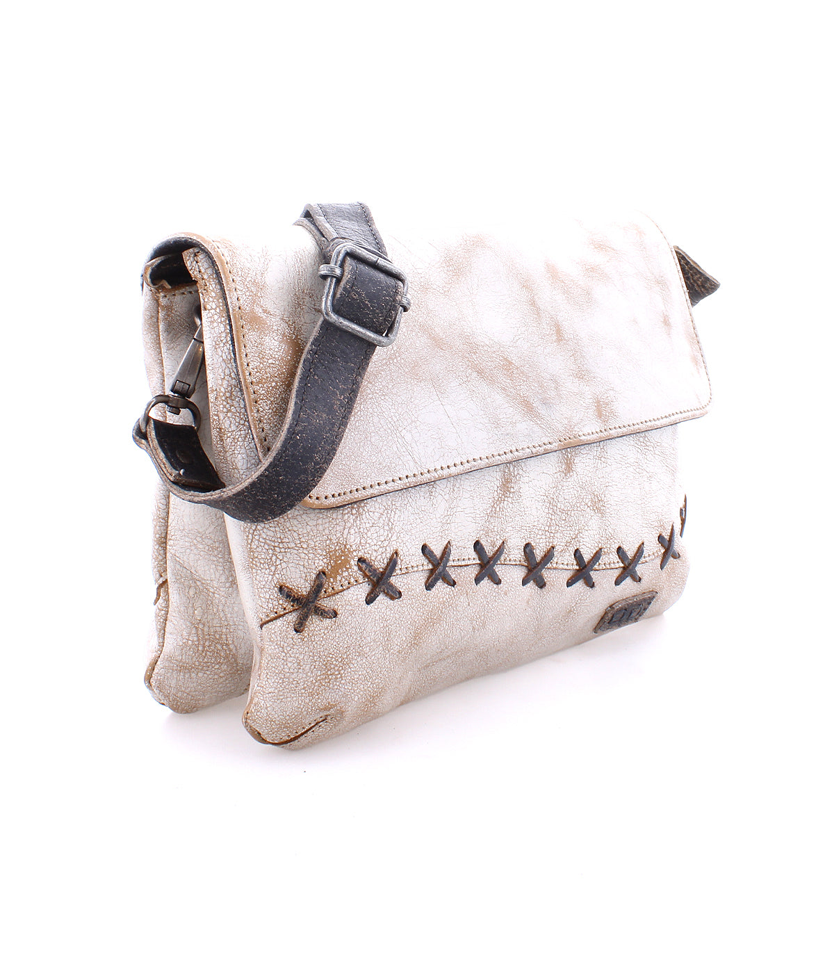 A worn leather Cleo satchel with cross-stitch detailing and a zipper top closure on a white background by Bed Stu.