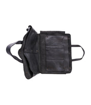 The Bed Stu Commuter black leather messenger bag is shown open from above, revealing interior compartments perfect for laptops, a secure flap, and side straps—a stylish and versatile multifunctional commuter bag.